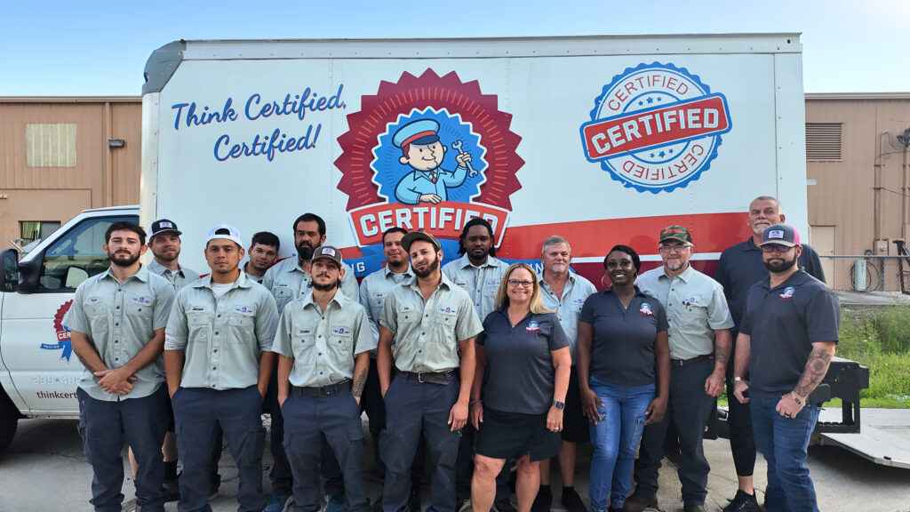 Employees in uniform stand before a Certified company truck displaying a bold logo and the slogan, "Think Certified, Certified!.