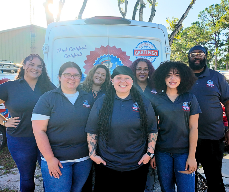 a group of Certified technicians posing outside behind a Certified work van