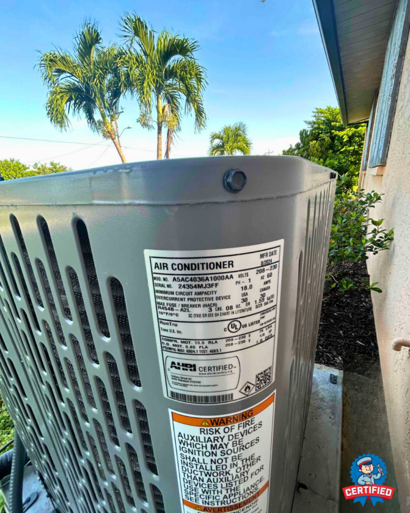An outdoor AC unit sits by a house, with spec and warning labels; palm trees and bushes stress HVAC maintenance in SW Florida.